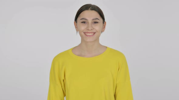 Spanish Woman Shaking Head in Approval on White Background