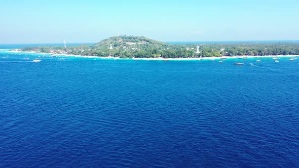 Beautiful aerial tourism shot of a summer white paradise sand beach and turquoise sea background in 