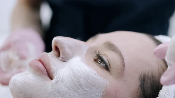 Cropped View of Beautician Removing Facial Mask From Face