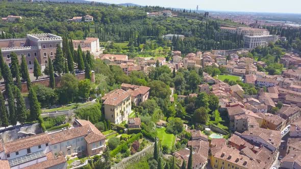 Panoramic aerial drone view of Verona,Italy. Drone spins and video of city's houses with tiled roofs