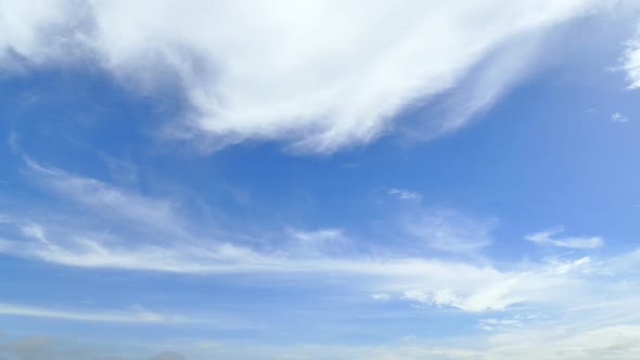 Time lapse of white cloud moving pass around sky background