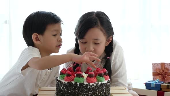 Cute Asian Children Looking Birthday Cake