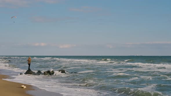 Romantic Blonde Woman Walking on the Beach in Autumn Sunny Day