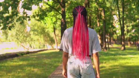 Student Walks in Park