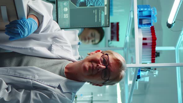 Vertical Video Portrait of Senior Scientist Woman Looking Exhausted at Camera