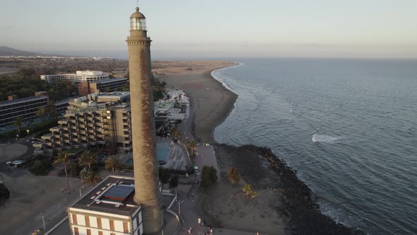 Maspalomas lighthouse and resort touristic town by the beach, Canary Islands
