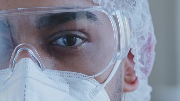 Close Up Male Black Tired and Sleepy Eye Half Face Man Doctor Wearing Personal Protective Glasses