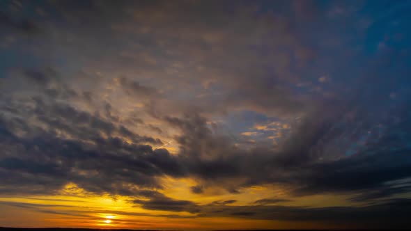 Timelapse Beautiful Sky at Dawn. The Clouds Are Flying and the Sun Is Shining