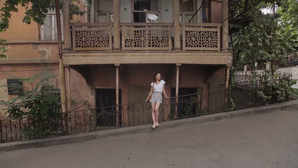 The Girl Admires the View of Tbilisi Streets, Georgia. Typical Architecture of Old Part of City