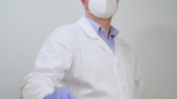 Doctor in gloves show Biohazard Specimen Bag with Positive PCR Antigen Test