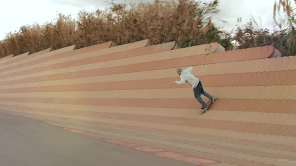 Skateboarder Doing Dangerous Stall Trick on Street, Skater Man Perform Extreme Big Gap Professional