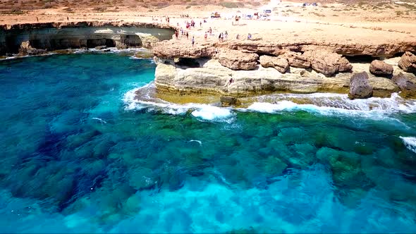 Crystal clear turquoise blue water at sea caves Ayia Napa Cyprus view