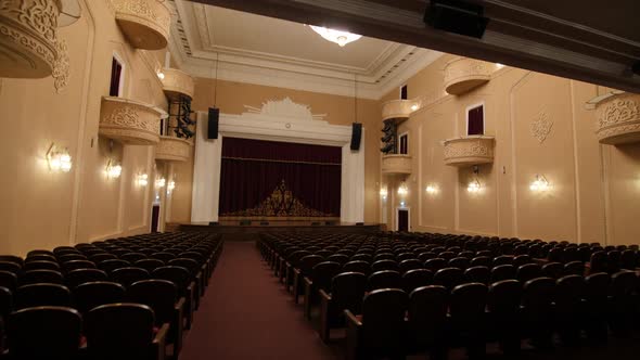 Theater Hall with Empty Seats Balconies and Vintage Luster