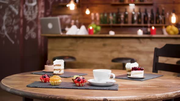 Medium Shot of Sweet, Cakes and a Cup of Coffee