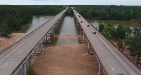 Aerial of cars driving on bridge that crosses over the San Jacinto River in Houston, Texas