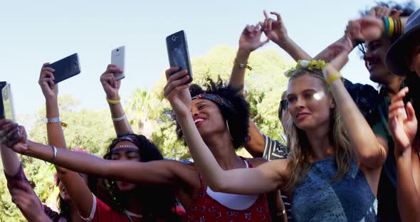 Female friends having fun at music festival 4k