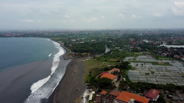 Black Sand Beach in Gray Foggy Day Mixing Water