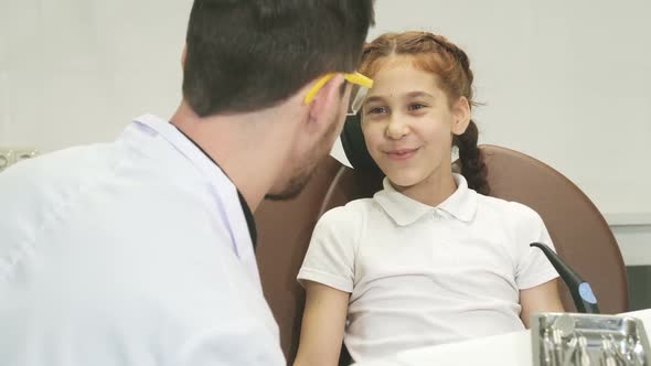 A Little Girl Has Come To the Dentist and Complains of a Pain in a Tooth