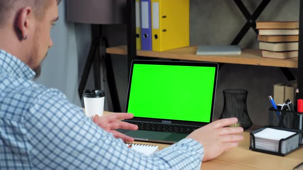 Green screen laptop concept: Businessman tells listen employee online video call