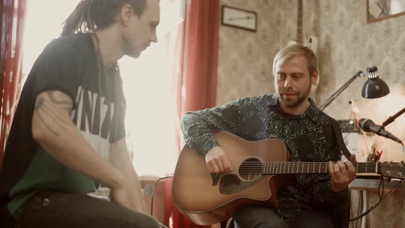 Male Musicians Rehearsing at Home