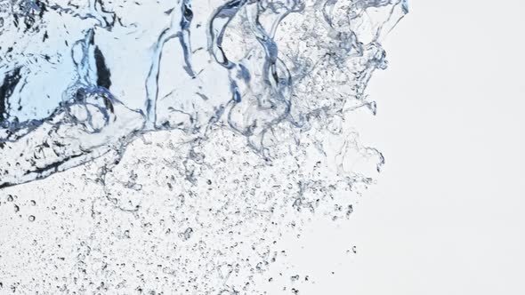 Super Slow Motion Shot of Side Water Splash Isolated on White Background at 1000Fps