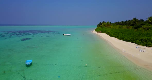 Wide drone abstract view of a white paradise beach and blue water background in colourful 