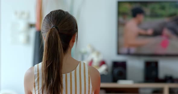 Woman watch tv at home