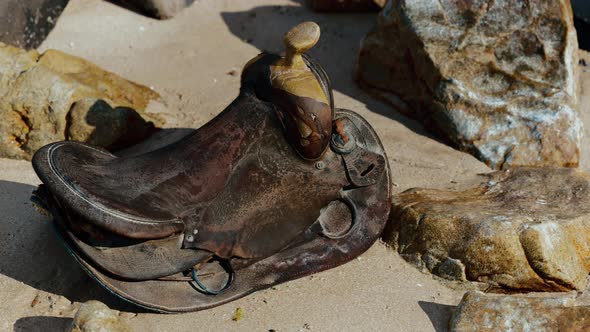 Very Old Horse Saddle on Sand Beach