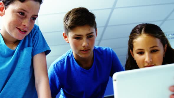 Student using digital tablet in classroom