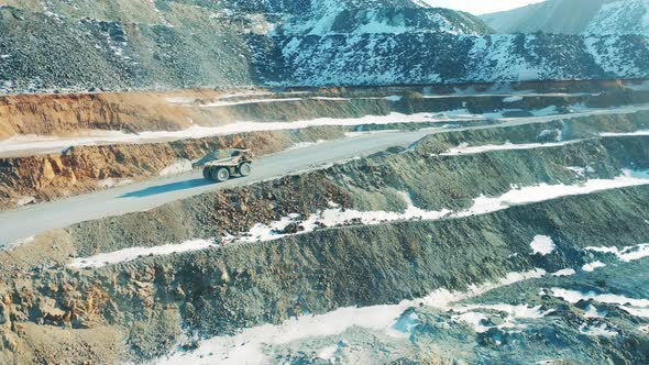 Truck is Riding Along the Road of a Copper Quarry