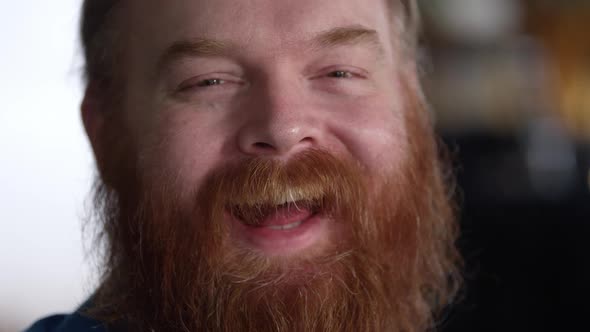 Jolly man with red beard laughing