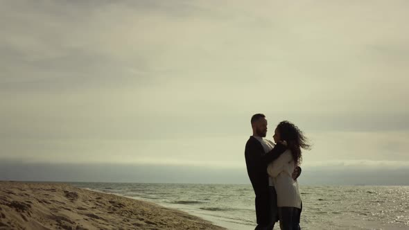 Couple Standing Sea Beach in Casual Clothes