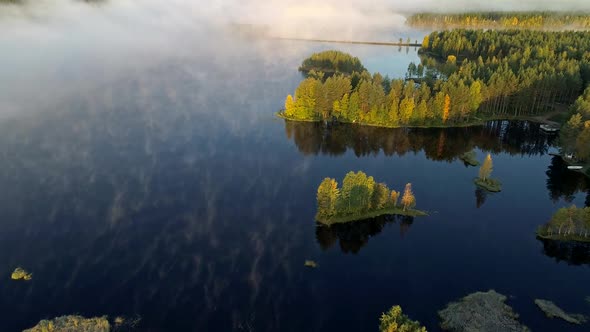 Aerial Shot of Foggy Lake with Islands Early in the Morning. Finland, Near Rovaniemi. FHD, 