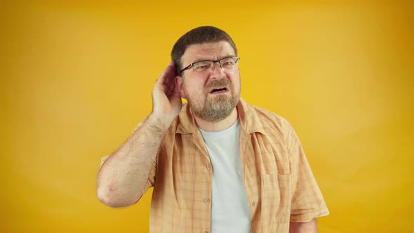 Adult man trying to hear interlocutor, health problems of middle aged people, deafness