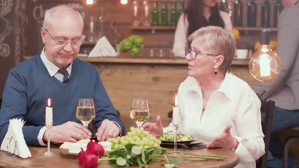 Senior Couple on a Romantic Date Having a Conversation