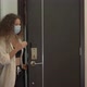 Mixed Race Young Woman Takes Off Disposable Face Mask - VideoHive Item for Sale