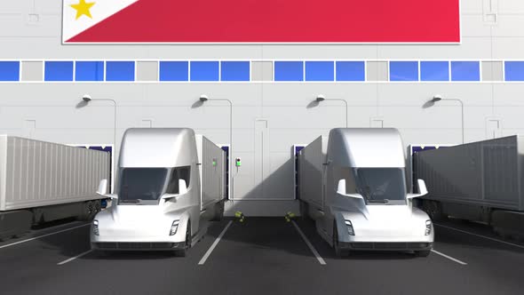 Electric Trucks at Warehouse Bay with Flag of the PHILIPPINES alt