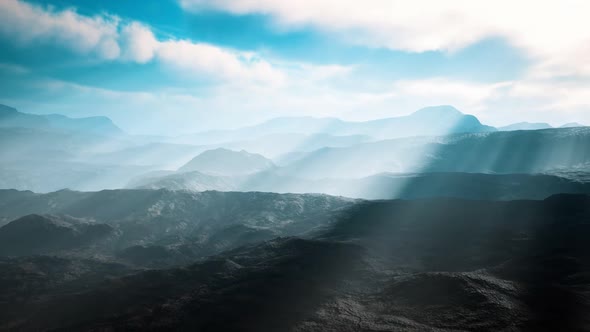 Aerial Vulcanic Desert Landscape with Rays of Light