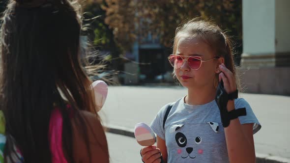 Two Girls Talking, Eating Ice Cream