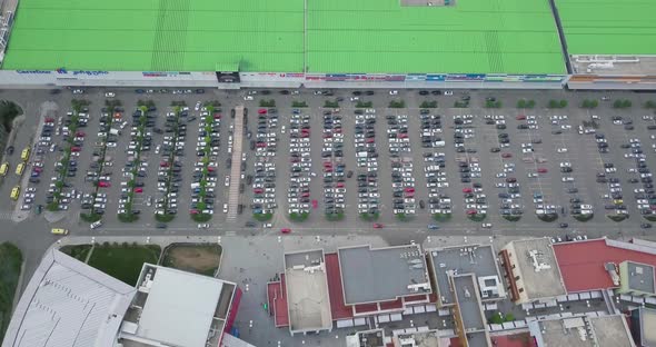 Top Aerial Overhead View Of Modern Shopping Mall And Parking Lot