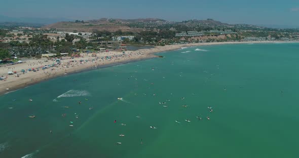 DANA POINT, California. Doheny State Beach. A Sunny Day Beach Scene with People Engaged in Beach