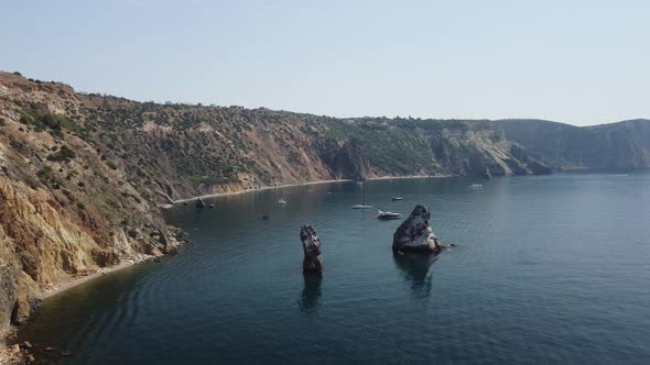 Aerial View From Above on Calm Azure Sea and Volcanic Rocky Shores