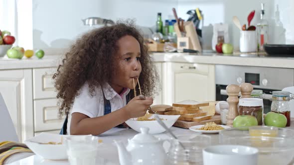 Little Girl Having Spaghetti for Dinner alt