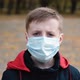 Portrait of Little Boy Wearing Medical Mask on Street in City - VideoHive Item for Sale