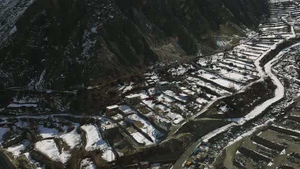 Aerial View Over Snow Covered Terraces In Hunza Valley. Circle Dolly