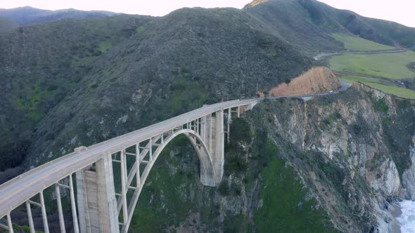 Aerial view cars passing Bixby Creek Bridge 