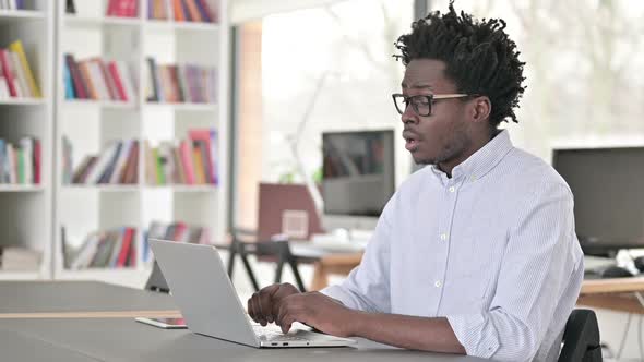 African Man Upset By Loss on Laptop