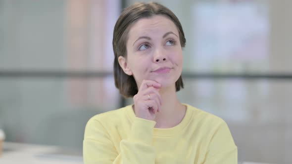 Portrait of Pensive Young Woman Thinking