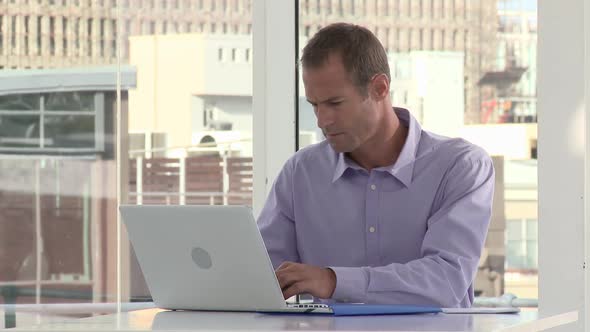 Businessman using laptop in office