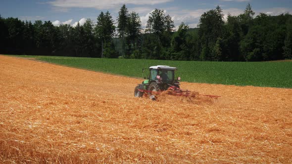 Tractor harvesting wheat